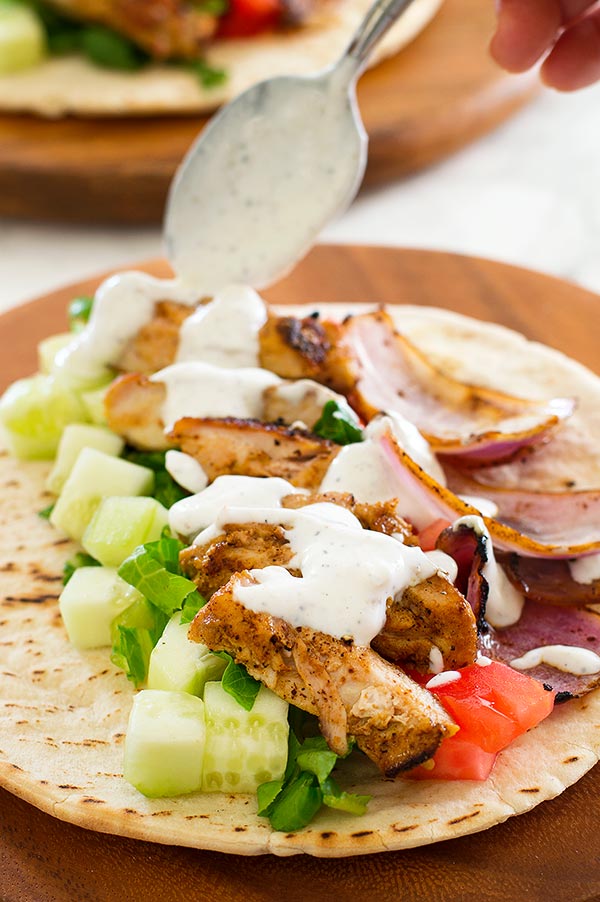 A healthy freezer meal recipe with a mediterranean twist - Chicken Shawarma with Yogurt Sauce.