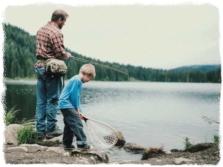A father and his son fishing together on a lake how to love yourself.