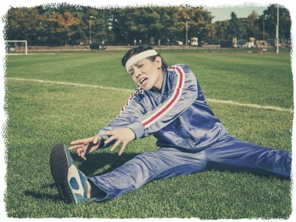 woman-stretching workout motivation tips | how to motivate yourself to workout alone | motivation to workout at home